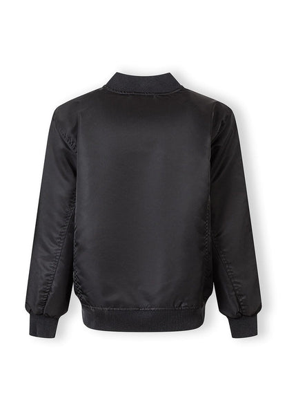 Boys black nylon bomber jacket, back view, features ribbed cuffs and hem.