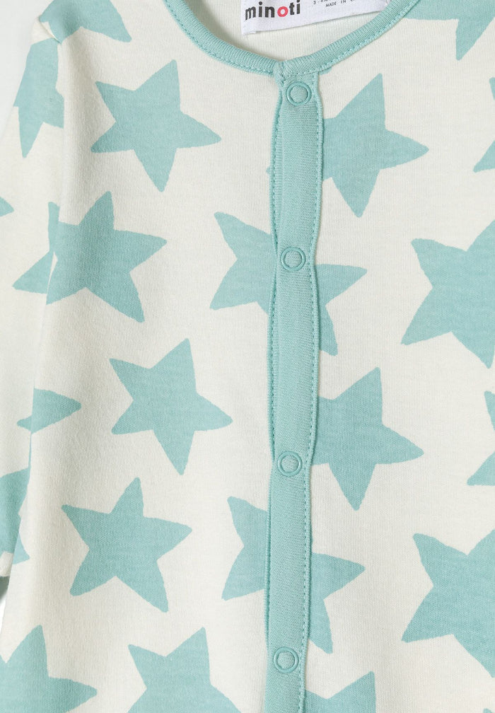 Detail of a mint long sleeve sleepsuit for boys with star pattern and front press stud fastening.