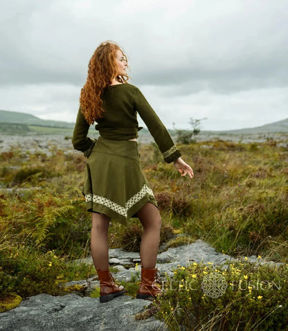 Elva olive green wrap top showing the cropped fit, long sleeves and wrap ties secured around the waist.