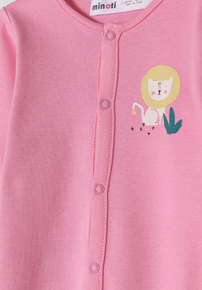 Detail of a pink baby pyjama with a lion print and front press stud fastening.
