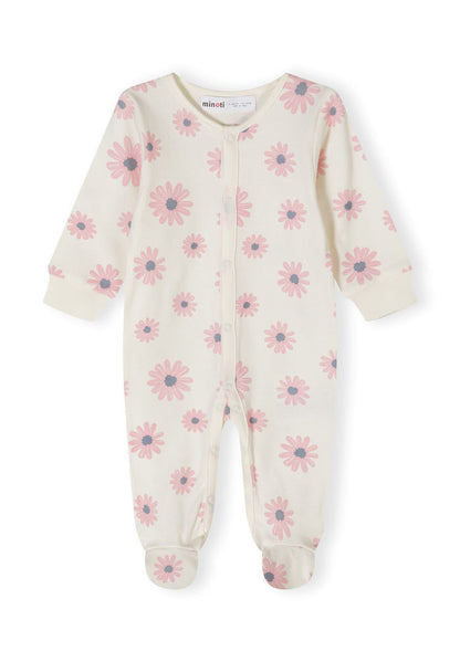 Detail of a girls' long-sleeve sleepsuit in cream with pink floral pattern and integrated feet.