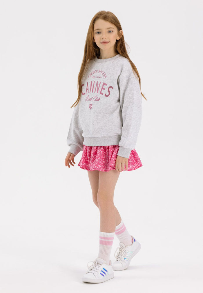 Girls pink crinkle layered pleats skirt, front view with frills.