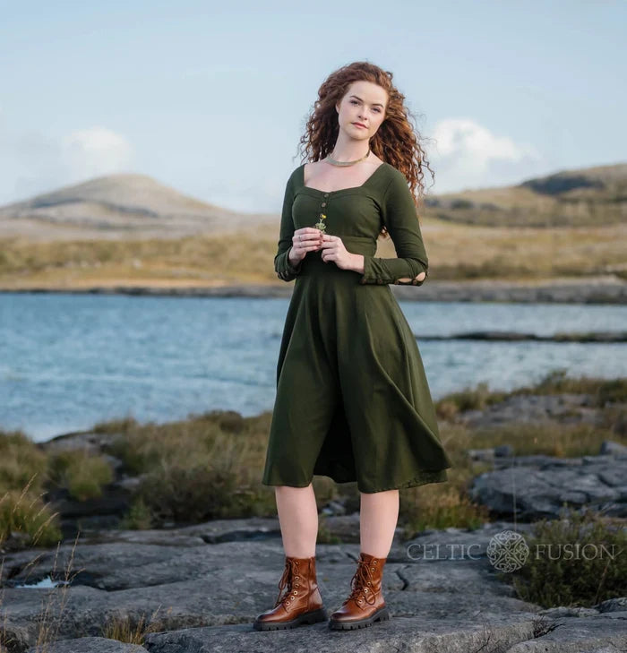 Deep green cotton corset midi dress with pockets, long buttoned sleeves and a square neckline.