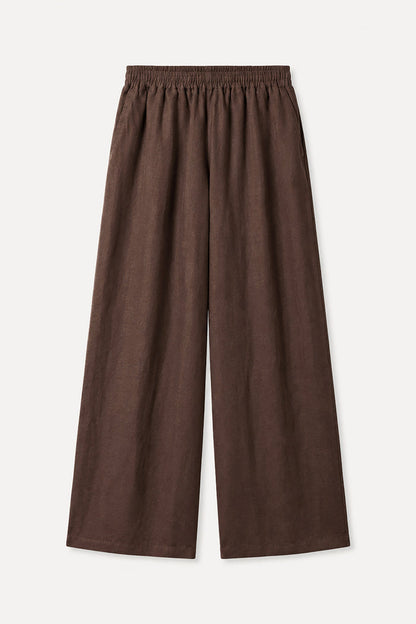 Brown wide-leg pants on a light beige background