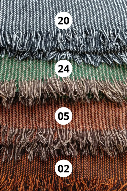 Handwoven shawl swatch options in grey, green and rust tones, showing striped wool blend weave and fringe detail by Celtic Fusion